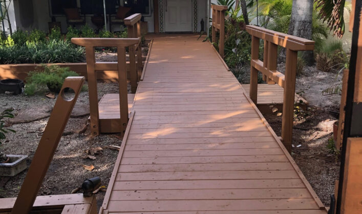 Shadow box painted fence and wood deck