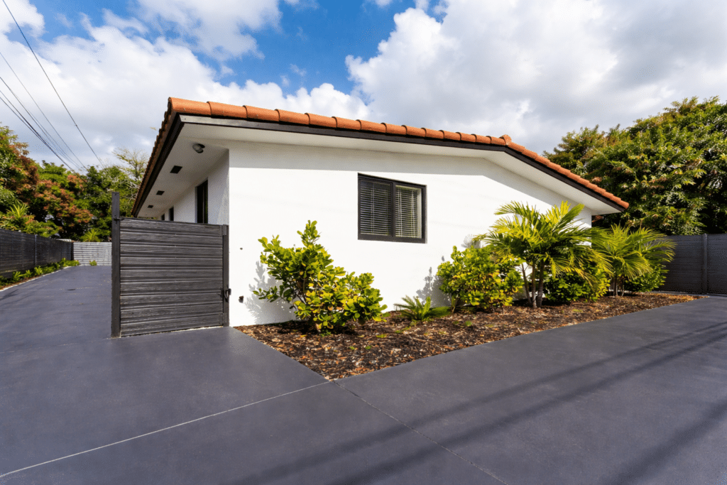 Concrete driveway with privacy fence