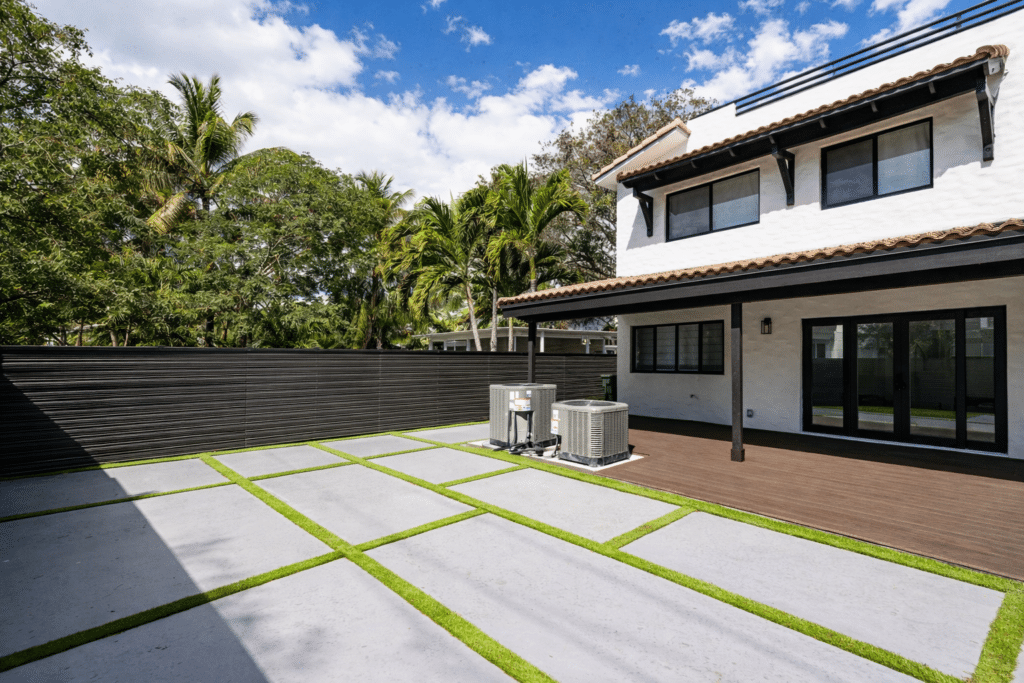 backyard with concrete patio grid design