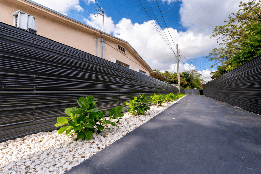 Concrete driveway with privacy fence