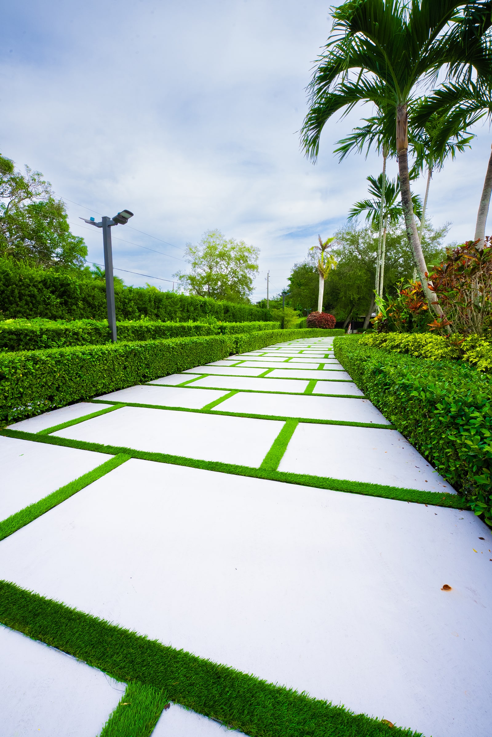 Concrete walkway with pavers