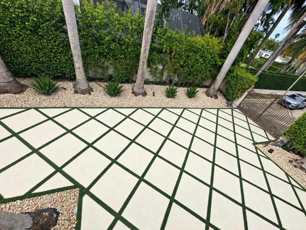 Concrete courtyard with diamond-pattern artificial turf joints