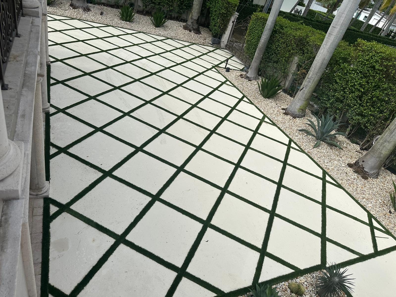 Diamond-pattern decorative concrete slabs with turf joints installed by Canet Group