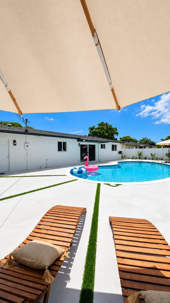 Wide view of a renovated backyard pool by Canet Group