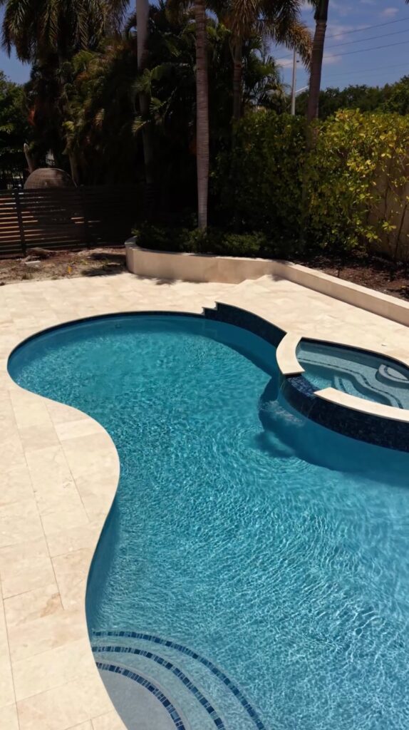 Pool and spa renovation with a new finish and coping by Canet Group